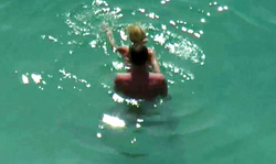 Beautiful beach sex in water with a long-legged babe