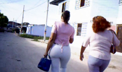 Filming how two spicy big booty ladies are walking on the street