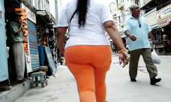 Spotted an exciting big booty lady in tight orange pants