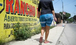 Aqua-colored shorts are emphasizing her hot big booty