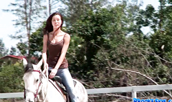 Slender cutie with innocent face Brooke Skye rides a horse while being topless