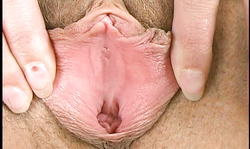 Smiling Candy Girl reveals naked hairy snatch in the bedroom