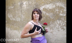 Chubby Cosmid lady is slowly undressing and showing her lingerie