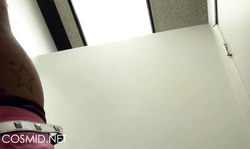 Sexy Cosmid brunette shows awesome boobs and pink miniskirt in locker room