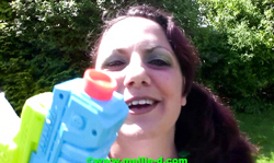 Horny as fuck Mellie D is playing with a water gun and her girlfriend