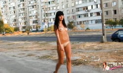 Long-legged brunette on high heels demonstrates her good on public