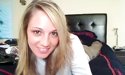 Playful blondie Nikki Sims pose sexy in black fishnet and glossy high heels