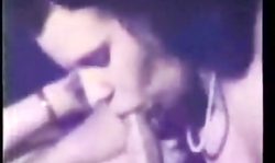 Black-haired babe sensually blows a tasty boner in Retro porn movie