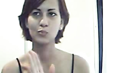 Elegant-looking girlfriend sticks a white dildo in her snatch