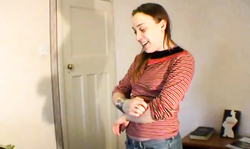 Young lass in striped stockings shows off her snatch