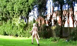 Blonde from UK is lying naked on the grass and masturbating