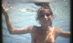 Smiling sex angel spotted dancing naked underwater