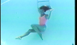 Sweet long-legged brunette enjoys the underwater photo shoot