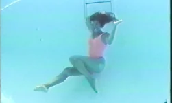 Sweet long-legged brunette enjoys the underwater photo shoot