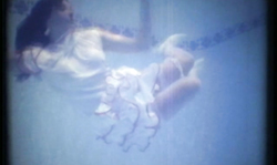 Smiling brunette with perfect round ass spotted underwater