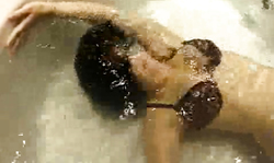 Underwater solo featuring a big-boobed brunette babe