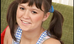 Pigtailed busty BBW treats her accurate shaved pussy