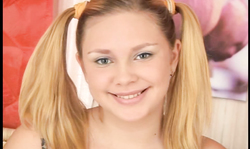 Pigtailed and young BBW sticks a purple toy in her crack