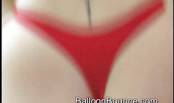 Amateur MILF in red panties jumps on a big red balloon