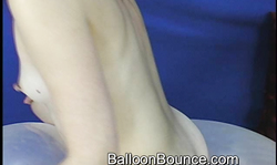 Foxy redhead lass with small tits bounces on balloon