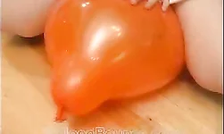 Small-tit lady in sleepwear rides her favorite orange balloon
