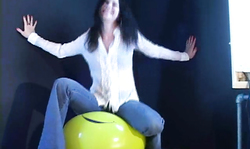 Cutie in blue jeans and white skirt adores balloons