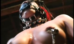 Submissive chained doll with masked face treated by two Dominatrixes