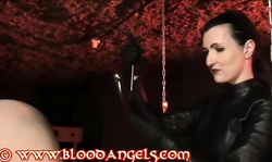 Beauty in black leather bonded her submissive sex slave