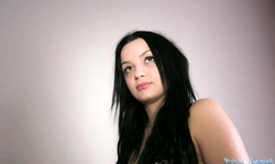 Black-haired beauty undressing specially for Public Agent