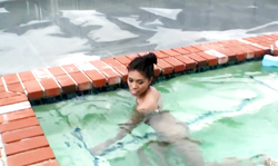 Perfect Asian Small Teen poses fully naked in the beautiful pool