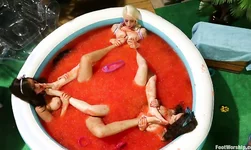 Small red pool filled with Lorelei Lee, Casey Calvert and Rilynn Rae