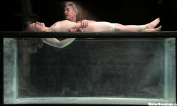 Chained cutie Madison Young is being dunked by her master