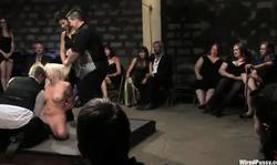 Lorelei Lee is standing on the knees and sucking Princess Donna Dolore's strapon