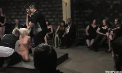 Lorelei Lee is standing on the knees and sucking Princess Donna Dolore's strapon
