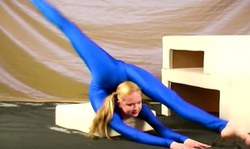 Her crazy flexibility looks hotter than hell especially in blue suit