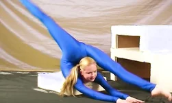 Her crazy flexibility looks hotter than hell especially in blue suit
