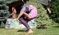 Outdoor posing session with extremely flexible gymnast