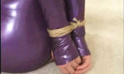 Fully bonded sex doll Amber Michaels is trying to scream