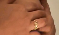 Sweet Asian girl takes off her white blouse and red miniskirt